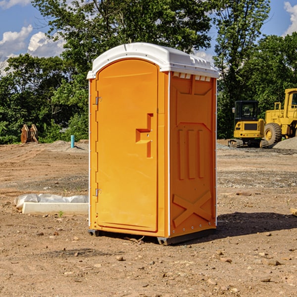 what is the cost difference between standard and deluxe portable toilet rentals in Andrew Iowa